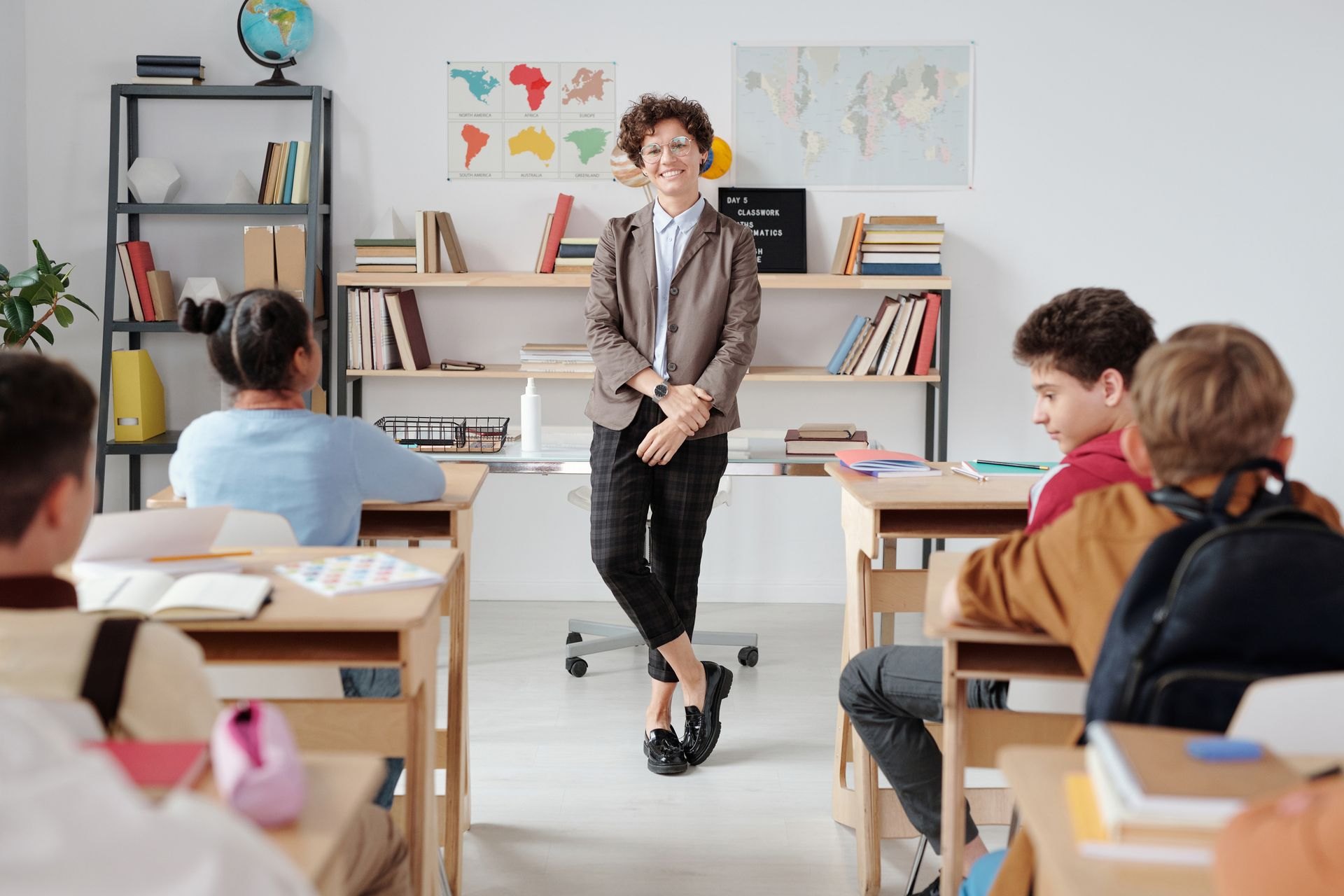 Teacher and students participating in a classroom lesson