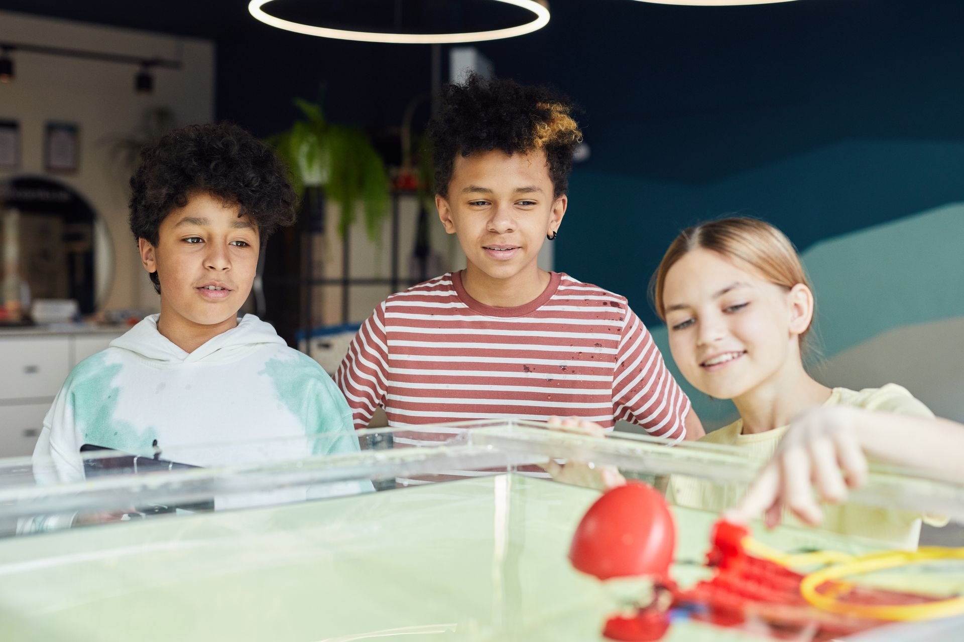 Children exploring a drone and robotics