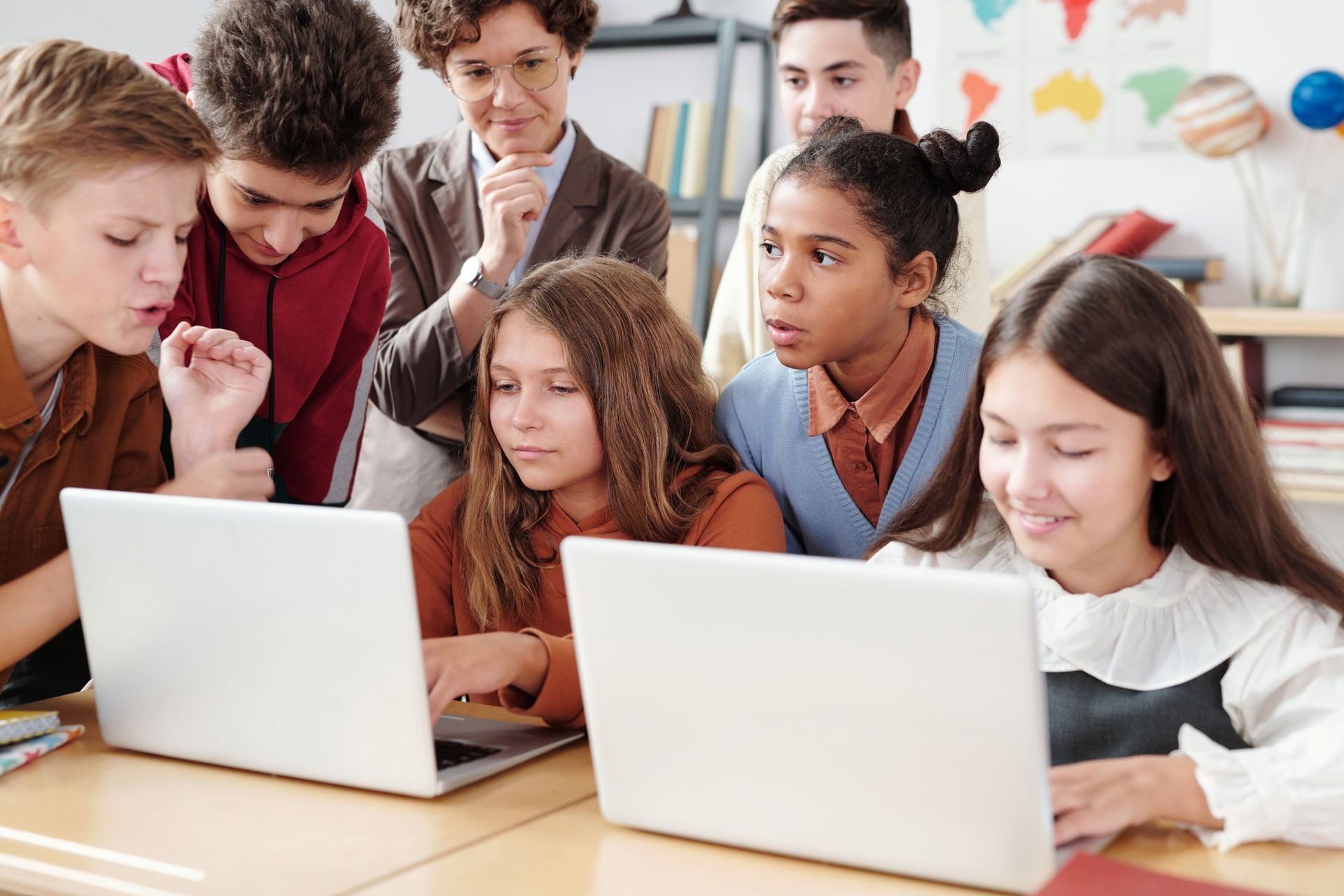 Students collaborating on laptops